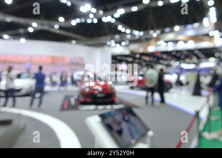 Blurred background of people attending in motor show exhibition event on Bangkok, Thailand Stock Photo