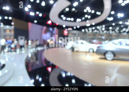 Blurred background of people attending in motor show exhibition event on Bangkok, Thailand Stock Photo