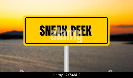 Sneak peek message written on yellow sign with blurry lake background. Conceptual sneak peek symbol. Copy space. Stock Photo