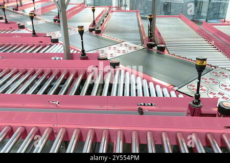 Automated Conveyor Belt Sorting Mechanism in a Logistics Center. Automatic Engineering Solution Handling and Preparing Parcels for Delivery to Clients Stock Photo