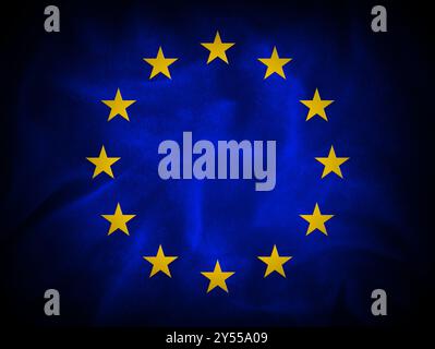 European flag illustration with dark textured fabric background (twelve golden stars for each country nation of Europe which are part of the union) Stock Photo