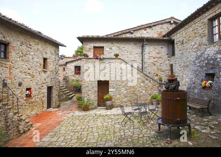 Surrounded by woods, vineyards, olive groves and cypress trees, Rocca di Castagnoli, Gaiole in Chianti, province of Siena, italy Stock Photo