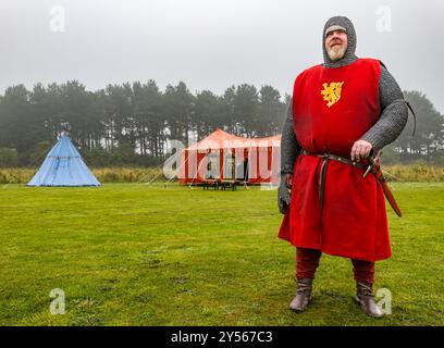 Re-enactor in Medieval knight costume armour at reenactment of Siege of Dirleton Castle, East Lothian, Scotland, UK Stock Photo