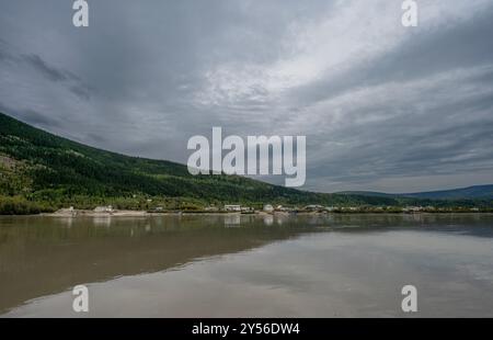 Distant view of Dawson City, Yukon from the Yukon River Stock Photo