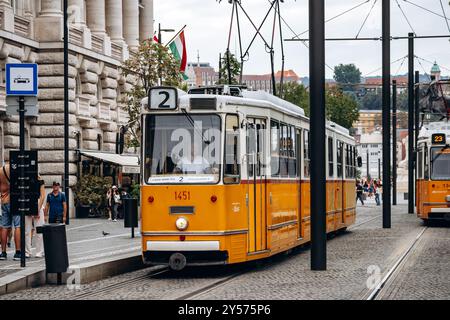 Budapest, Hungary - August 10, 2024: Traditional yellow tram in the center of Budapest Stock Photo