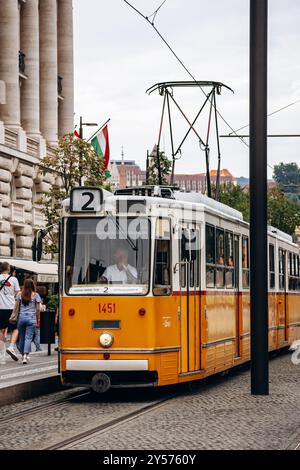 Budapest, Hungary - August 10, 2024: Traditional yellow tram in the center of Budapest Stock Photo