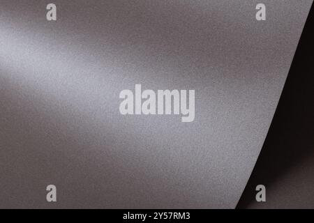 Gray paper background with a soft, recycled texture and subtle abstract pattern. Clean and modern surface, perfect for blank sheets or decorative spac Stock Photo
