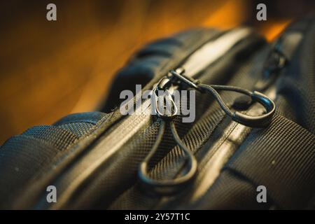 Dual zips on the top of a black backpack; high detail close up. Stock Photo