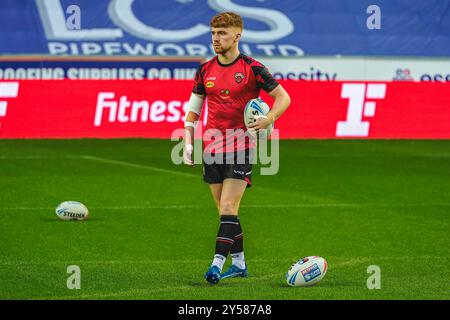 Salford Red Devils' Kai Morgan reacts to a try-saving tackle during the ...