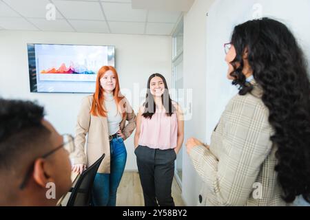 Professional teamwork of young people discussing business strategies and brainstorming in a meeting room office. Stock Photo