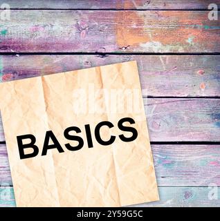 The term basics is prominently displayed in sleek black font against a clean white background, creating a striking visual effect Stock Photo