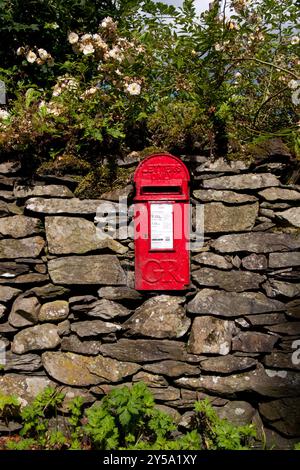 Georgian letterbox on drystone wall, Coniston, Lake District, Cumbria, England Stock Photo