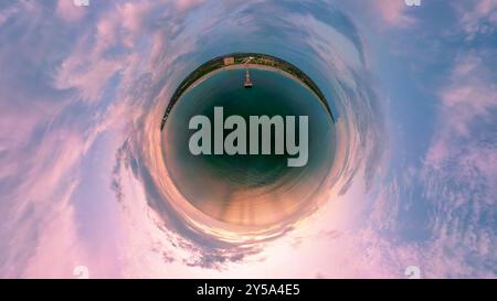 A tiny planet aerial view of a colourful sunrise over Juno Beach, Florida, USA Stock Photo