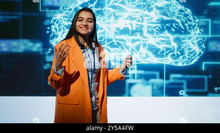 AI specialist showcasing cutting edge technologies, sharing industry knowledge. Speaker from across various industries come together to discuss latest developments in AI and Big Data, camera A Stock Photo