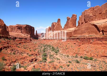 Arches National Park, Utah:: The Park Avenue Formation and trail. The sizes of the formations can be seen when compared to the miniscule size of the h Stock Photo