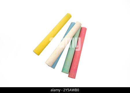 A bunch of colorful, yellow, white, blue, green and pink chalk sticks isolated on a white background Stock Photo