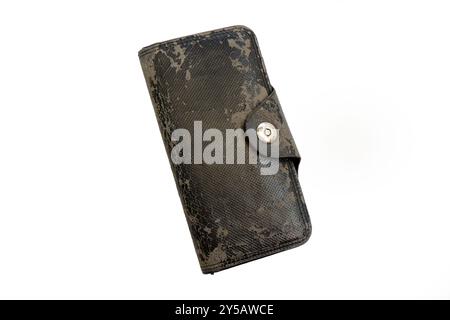 An old black wallet with peeling leather, isolated on a white background Stock Photo