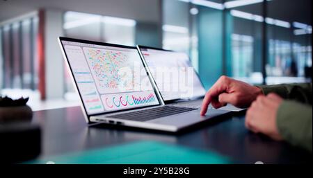 Male Data Analyst Predicting Market Trends On Virtual KPI Dashboard In Emerging Financial Business Concept. Stock Photo
