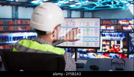 Warehouse Inventory Management On Computer. Staff In Office Stock Photo