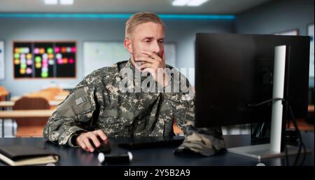 Military Student Education. Army Soldier Veteran With Computer Stock Photo
