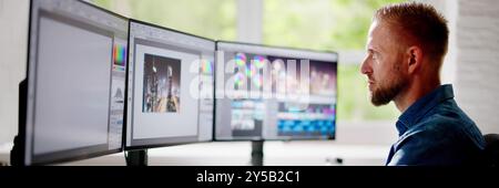 Graphic Web Designer Using Design Editing Software Stock Photo