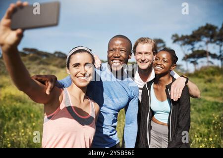 Happy people, friends and fitness with selfie in nature for hiking memory, photography or outdoor picture. Young, runners or interracial group with Stock Photo