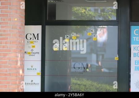 Cologne, Germany. 21st Sep, 2024. Bullet holes in the window pane of a watch store. A watch store in Cologne-Niehl was shot at during the night. Credit: Sascha Thelen/dpa/17�Թ����� Live News Stock Photo