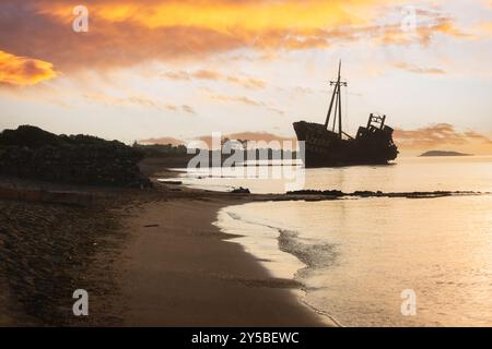 Dimitrios shipwreck silhouette on beautiful Valtaki beach near Gythio, Peloponnese, Greece at sunrise Stock Photo