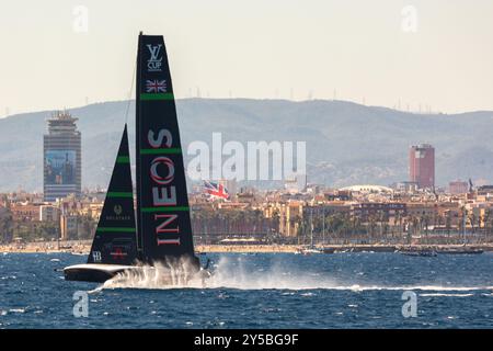 Barcelona, Spain - September 15th, 2024: Sailing team Ineos Britannia races passed fans on the beach in the Louis Vuitton 37TH America’s Cup Racing Stock Photo