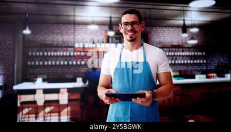 Happy Waiter Man In Store Or Small Cofee Shop Stock Photo