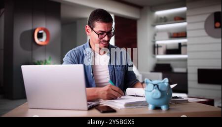 Calculating Finances Online Using Laptop. Tax,Budget And Bills Stock Photo