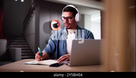 Student College At Home Using Laptop Computer Stock Photo