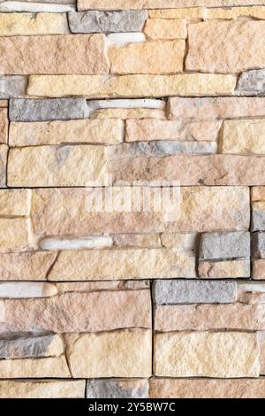 background from colored wild stones and river cobblestones in armenian home Stock Photo