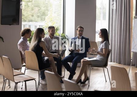 Business team leader woman talking to team on office meeting Stock Photo