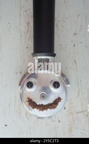 portafilter of an espresso machine, a good coffee puts a smile on your face Stock Photo