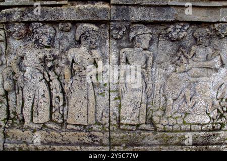 relief or carving on the stone wall at Penataran temple Stock Photo