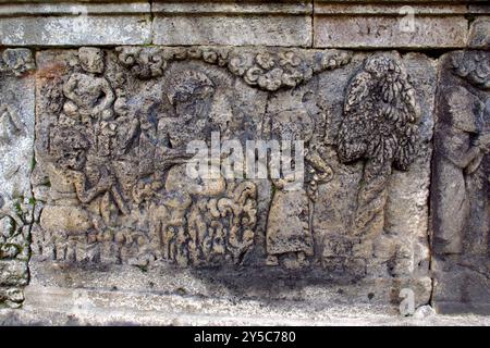 relief or carving on the stone wall at Penataran temple Stock Photo