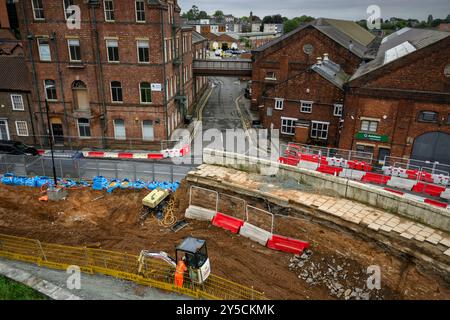 Road improvements & demolition work for Station Gateway Project (man working, roadworks & groundworks, machinery) - York, North Yorkshire, England UK. Stock Photo