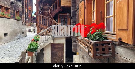 Most beautiful Swiss villages - pretty Griementz with traditional wooden houses and floral streets. popular tourist attraction in Valais Canton of Swi Stock Photo