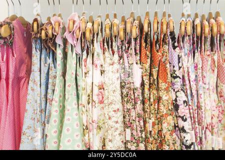 Floral pattern young girl dresses in children wear fashion shop Stock Photo