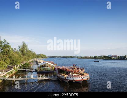 View of river boat tourist restaurants in kampot town cambodia Stock Photo