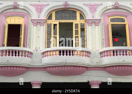 722 Pink mouldings-door frames-balusters-shell brackets-capitals, balconies of an Eclectic house white facade on 258 Calle Galiano Street. Havana-Cuba Stock Photo