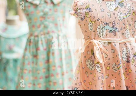 Floral pattern young girl dresses in children wear fashion shop Stock Photo