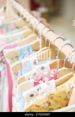 Floral pattern young girl dresses in children wear fashion shop Stock Photo