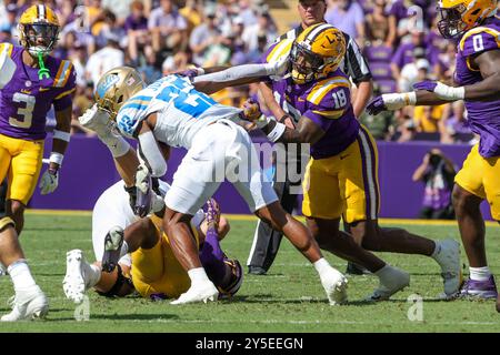 Baton Rouge, LA, USA. 21st Sep, 2024. LSU linebacker Greg Penn III (18) brings down UCLA running back Keegan Jones (22) during NCAA football game action between the UCLA Bruins and the LSU Tigers at Tiger Stadium in Baton Rouge, LA. Jonathan Mailhes/CSM (Credit Image: © Jonathan Mailhes/Cal Sport Media). Credit: csm/Alamy Live News Stock Photo