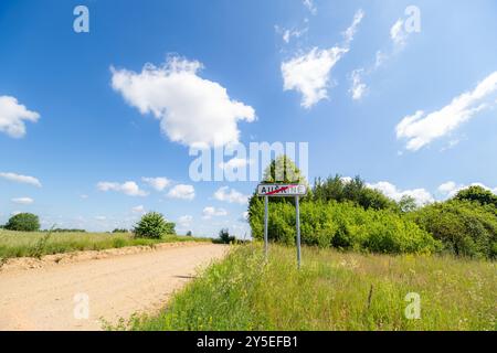 Ausrine, Varena district, Lithuania 06 08 2024: Road sign - the beginning of the settlement Stock Photo