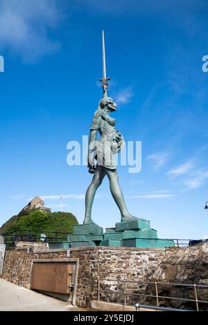 Verity by Damien Hirst, a steel and bronze statue displayed in the harbour in Ilfracombe, Devon, on a sunny day with blue skies. Stock Photo