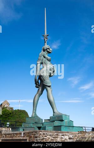 Verity by Damien Hirst, a steel and bronze statue displayed in the harbour in Ilfracombe, Devon, on a sunny day with blue skies. Stock Photo