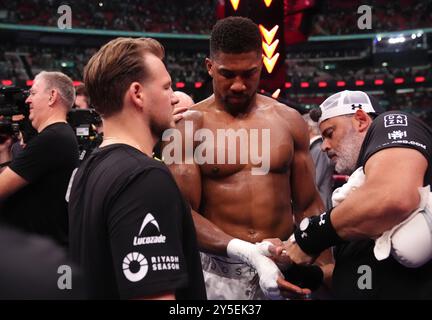 Anthony Joshua reacts to defeat by Daniel Dubois following the IBF World Heavy weight bout at Wembley Stadium, London. Picture date: Saturday September 21, 2024. Stock Photo