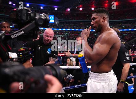 Anthony Joshua reacts to defeat by Daniel Dubois following the IBF World Heavy weight bout at Wembley Stadium, London. Picture date: Saturday September 21, 2024. Stock Photo